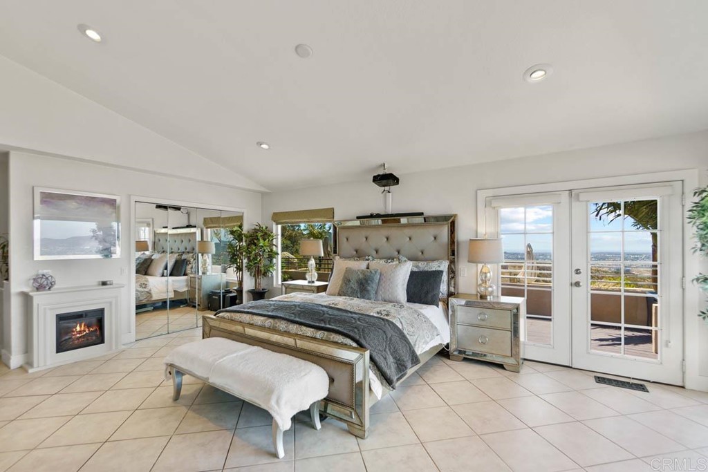 777 Phoenix Way San Marcos, CA 92078 - Photo 19 of 75 a bed room with a bed and a fireplace