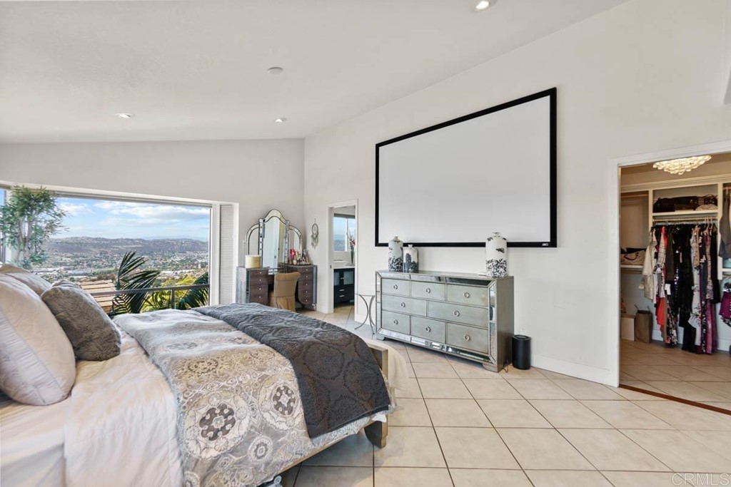 777 Phoenix Way San Marcos, CA 92078 - Photo 21 of 75 a bedroom with a bed and a flat screen tv