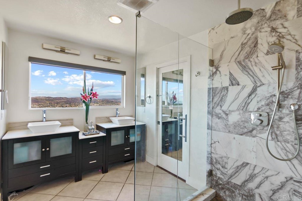 777 Phoenix Way San Marcos, CA 92078 - Photo 22 of 75 a bathroom with a double vanity sink mirror and shower