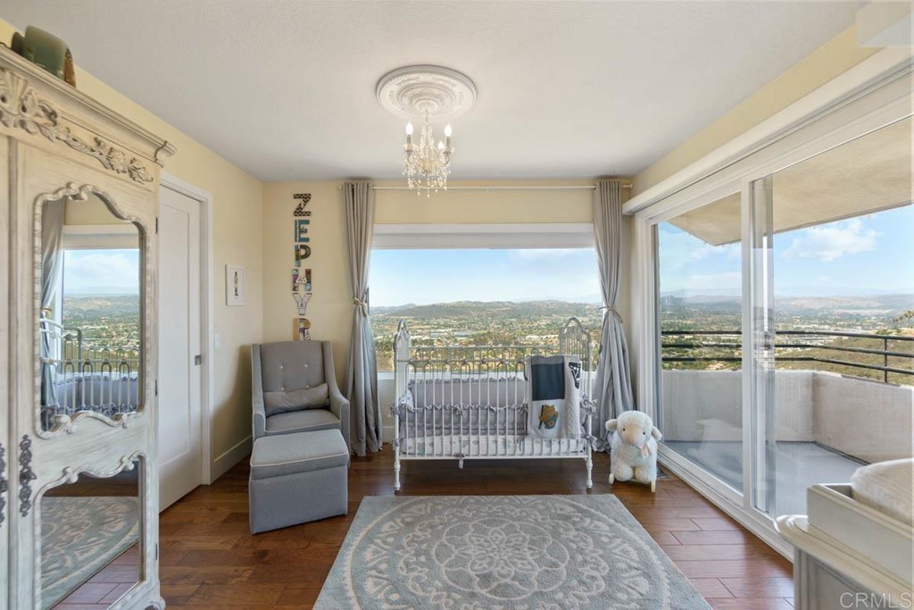 777 Phoenix Way San Marcos, CA 92078 - Photo 24 of 75 a living room with furniture and a floor to ceiling window