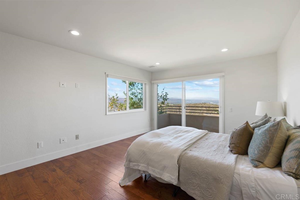 777 Phoenix Way San Marcos, CA 92078 - Photo 31 of 75 a bedroom with a large bed and a view of kitchen