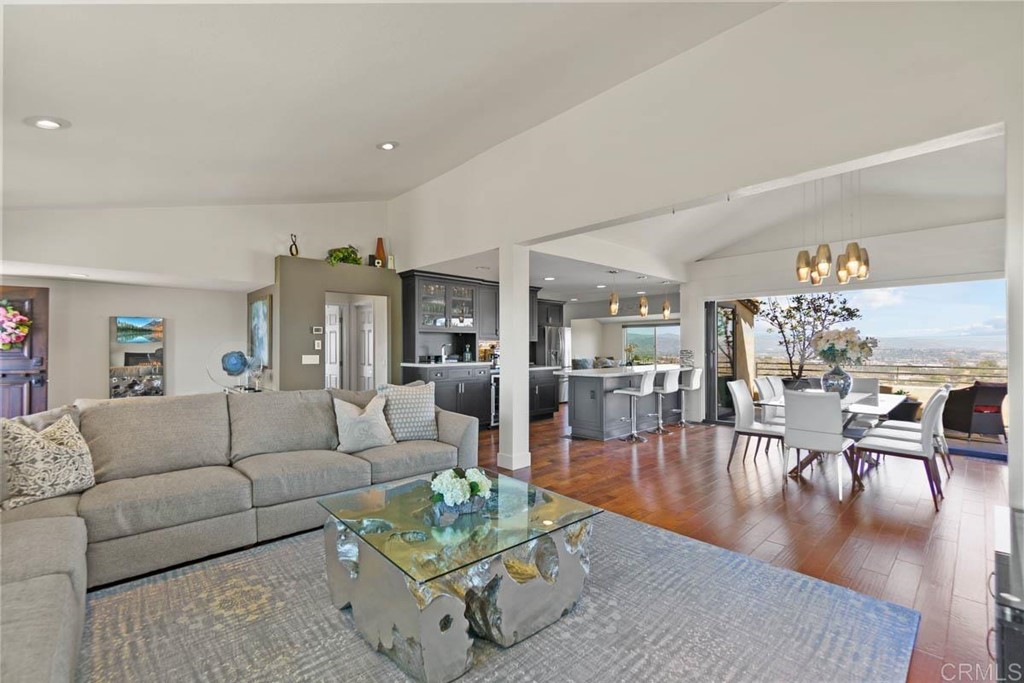 777 Phoenix Way San Marcos, CA 92078 - Photo 6 of 75 a living room with furniture wooden floor and kitchen view