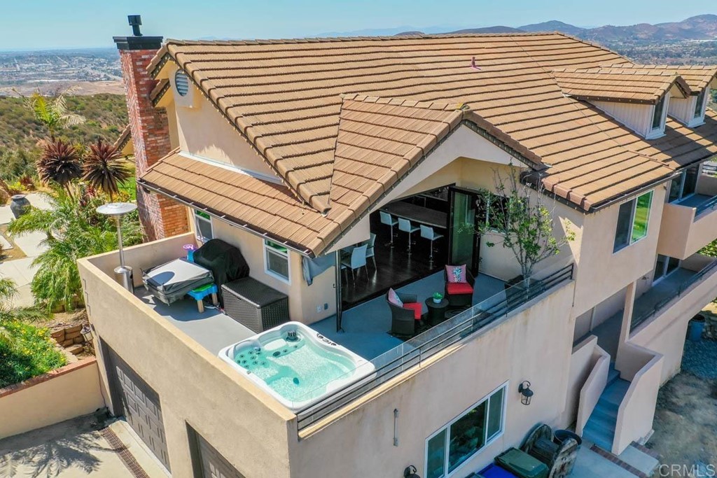 777 Phoenix Way San Marcos, CA 92078 - Photo 69 of 75 a view of a house with a deck and a backyard