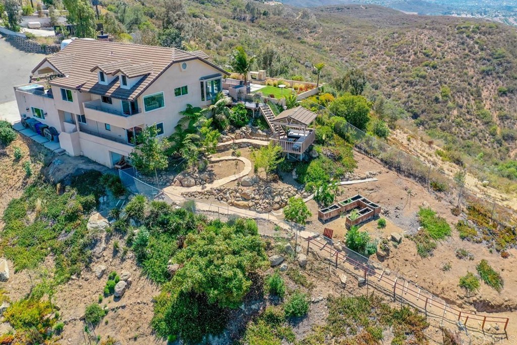 777 Phoenix Way San Marcos, CA 92078 - Photo 71 of 75 an aerial view of multiple houses with a yard