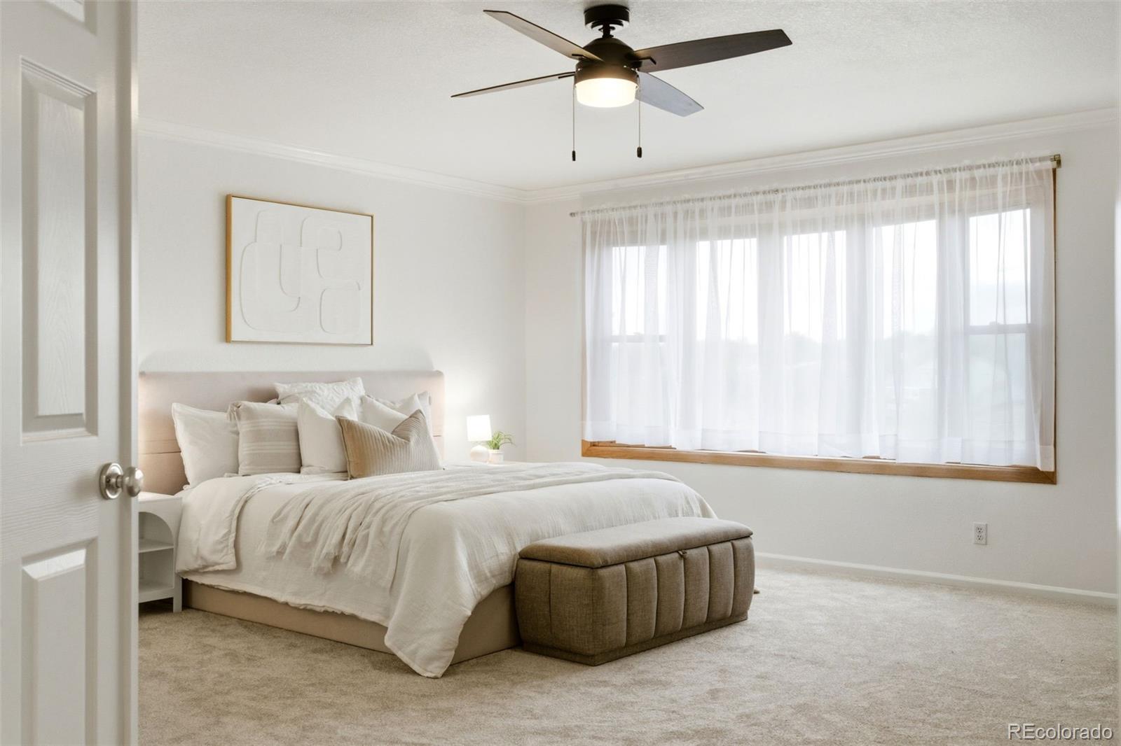 3033 East 108th Drive Northglenn, CO 80233 - Photo 17 of 50 a bedroom with a bed and window