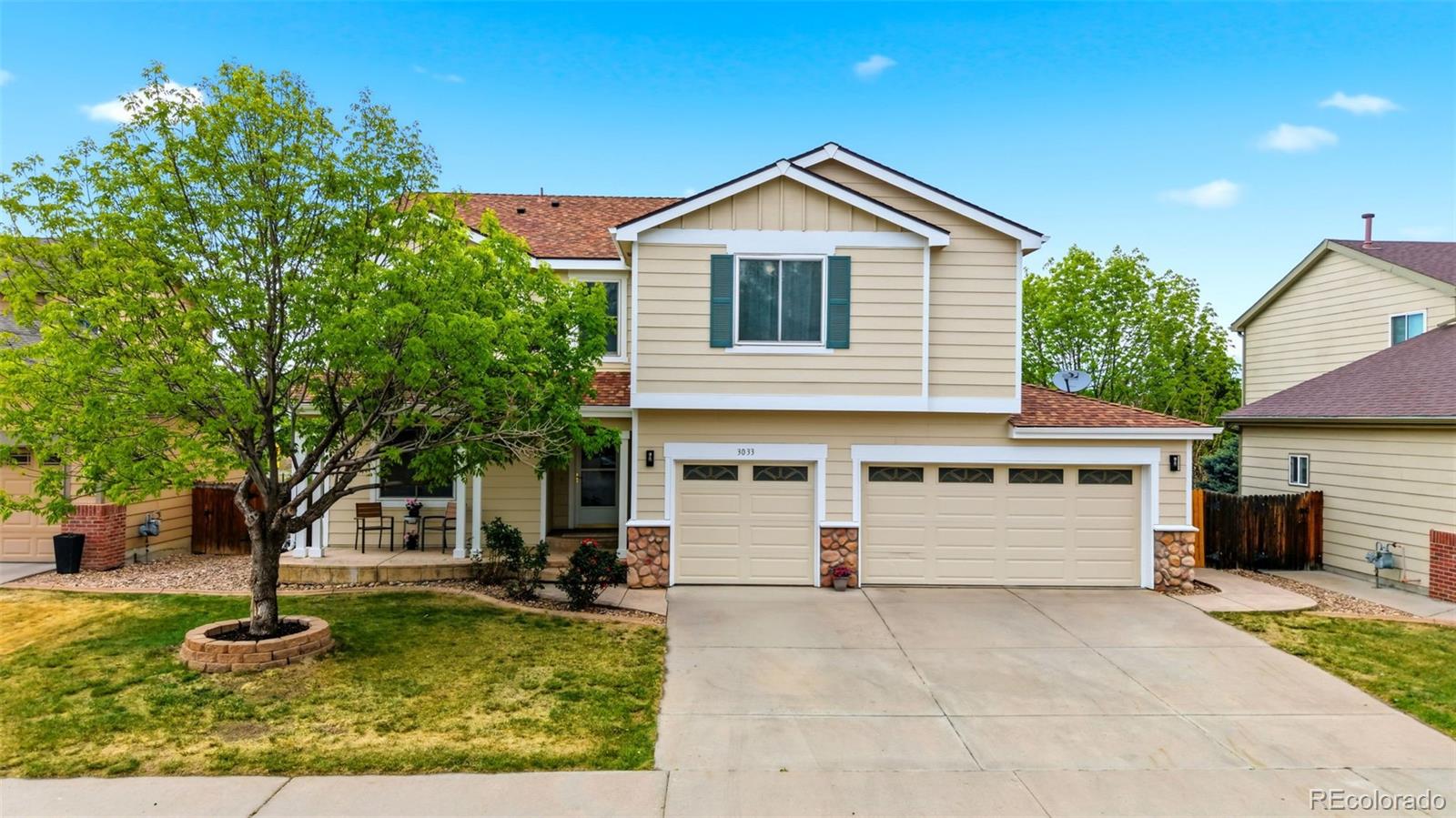 3033 East 108th Drive Northglenn, CO 80233 - Photo 2 of 50 a front view of a house with a yard