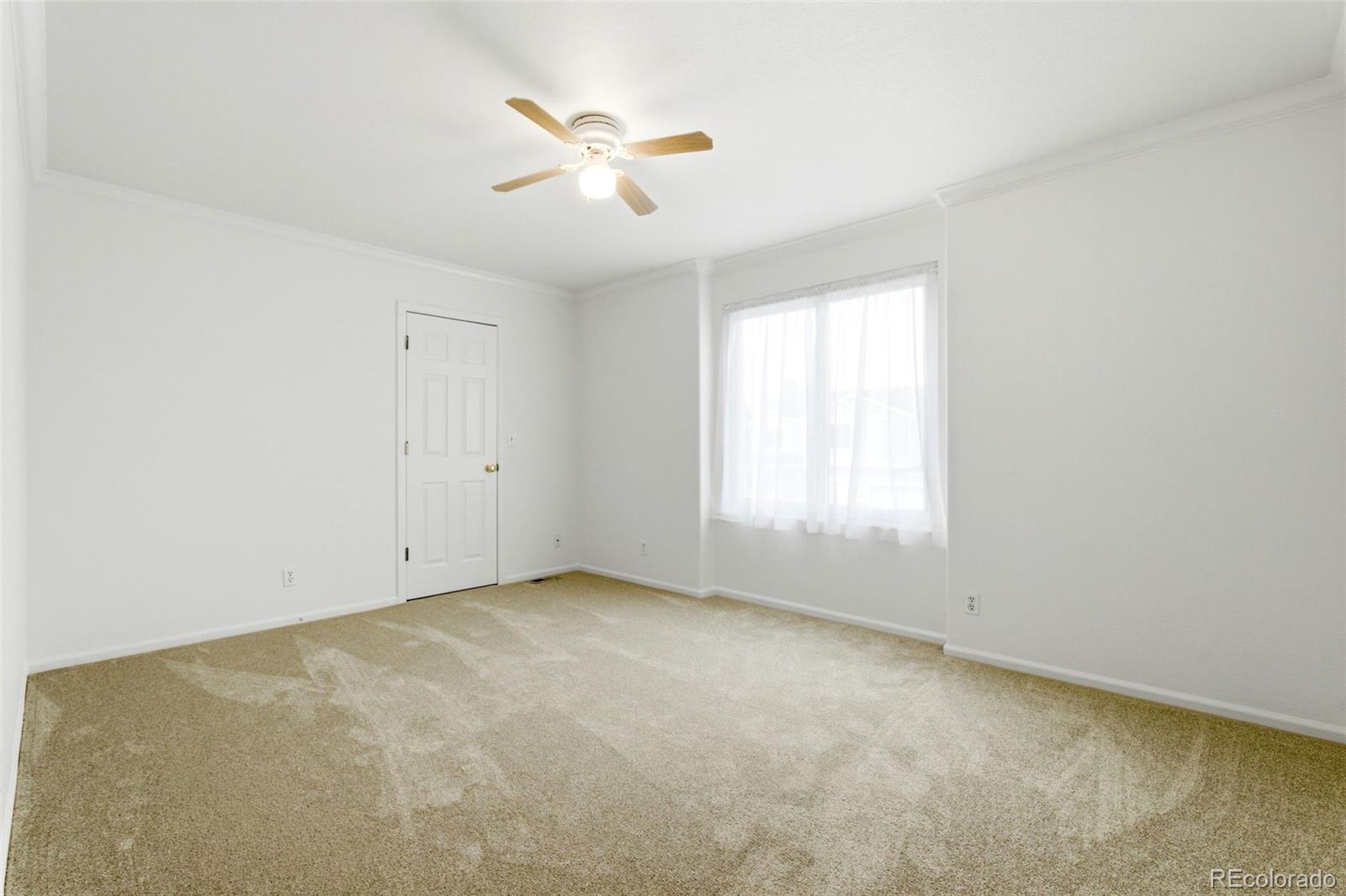 3033 East 108th Drive Northglenn, CO 80233 - Photo 26 of 50 an empty room with a window