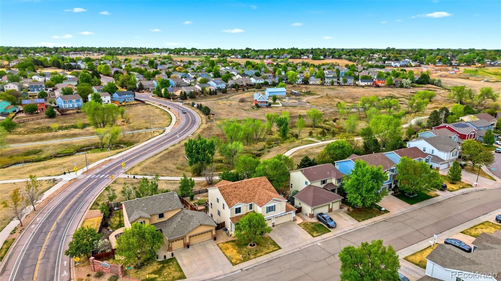 3033 East 108th Drive Northglenn, CO 80233 - Photo 48 of 50 an aerial view of a residential houses with outdoor space and street view