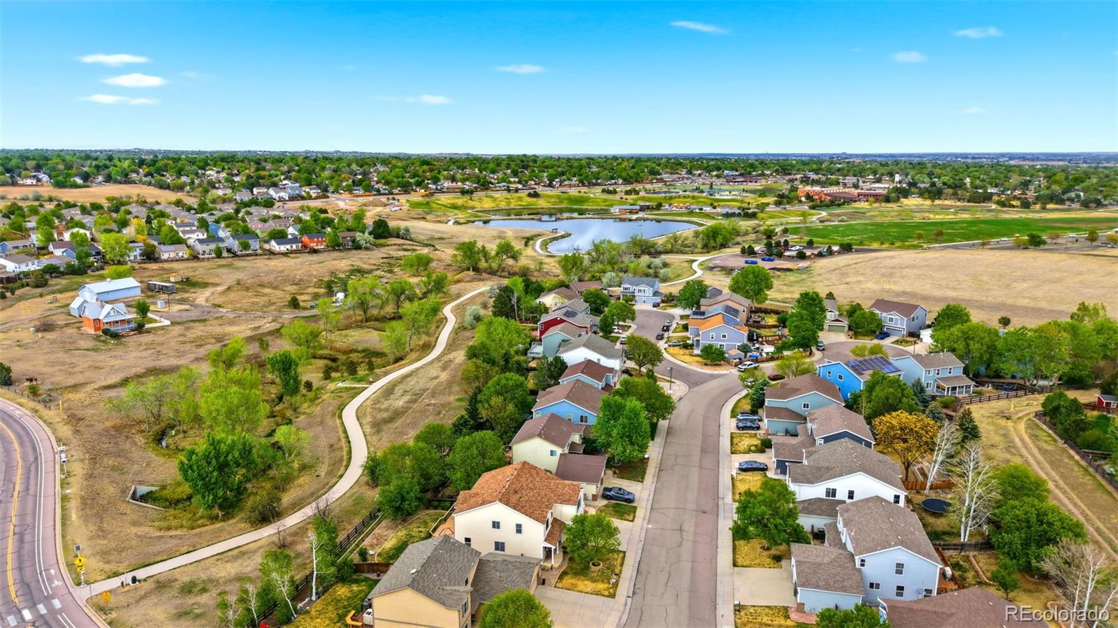 3033 East 108th Drive Northglenn, CO 80233 - Photo 49 of 50 an aerial view of residential building and lake