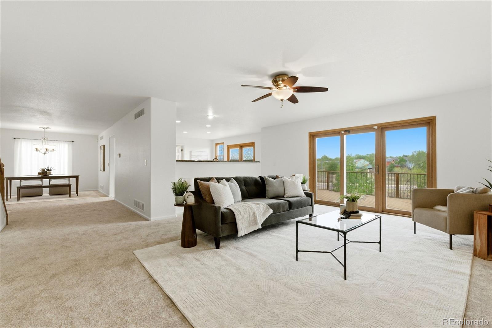 3033 East 108th Drive Northglenn, CO 80233 - Photo 5 of 50 a living room with furniture and a large window
