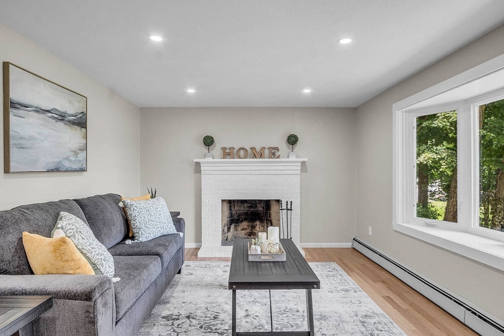 100 Dunstable Road North Chelmsford, MA 01863 - Photo 12 of 30 a living room with furniture and a fireplace