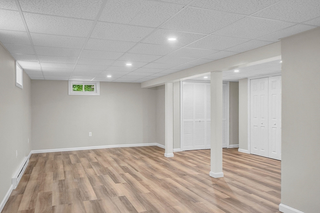 100 Dunstable Road North Chelmsford, MA 01863 - Photo 23 of 30 a view of empty room with wooden floor and fan