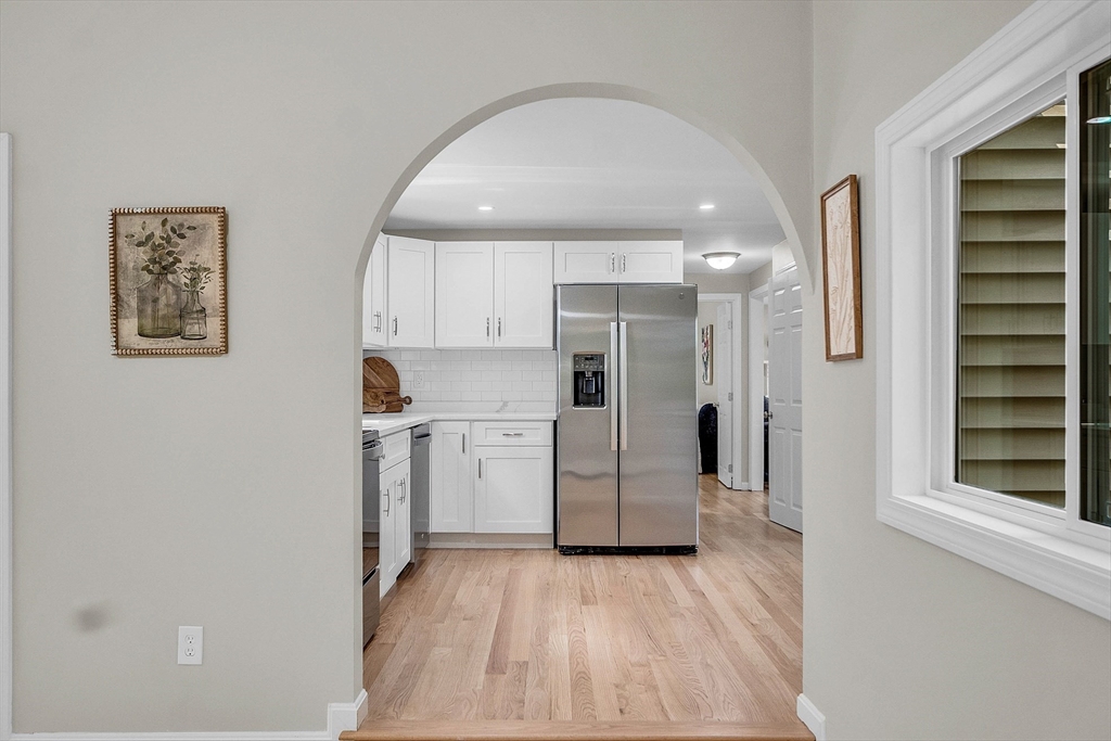 100 Dunstable Road North Chelmsford, MA 01863 - Photo 5 of 30 a kitchen with white cabinets and window