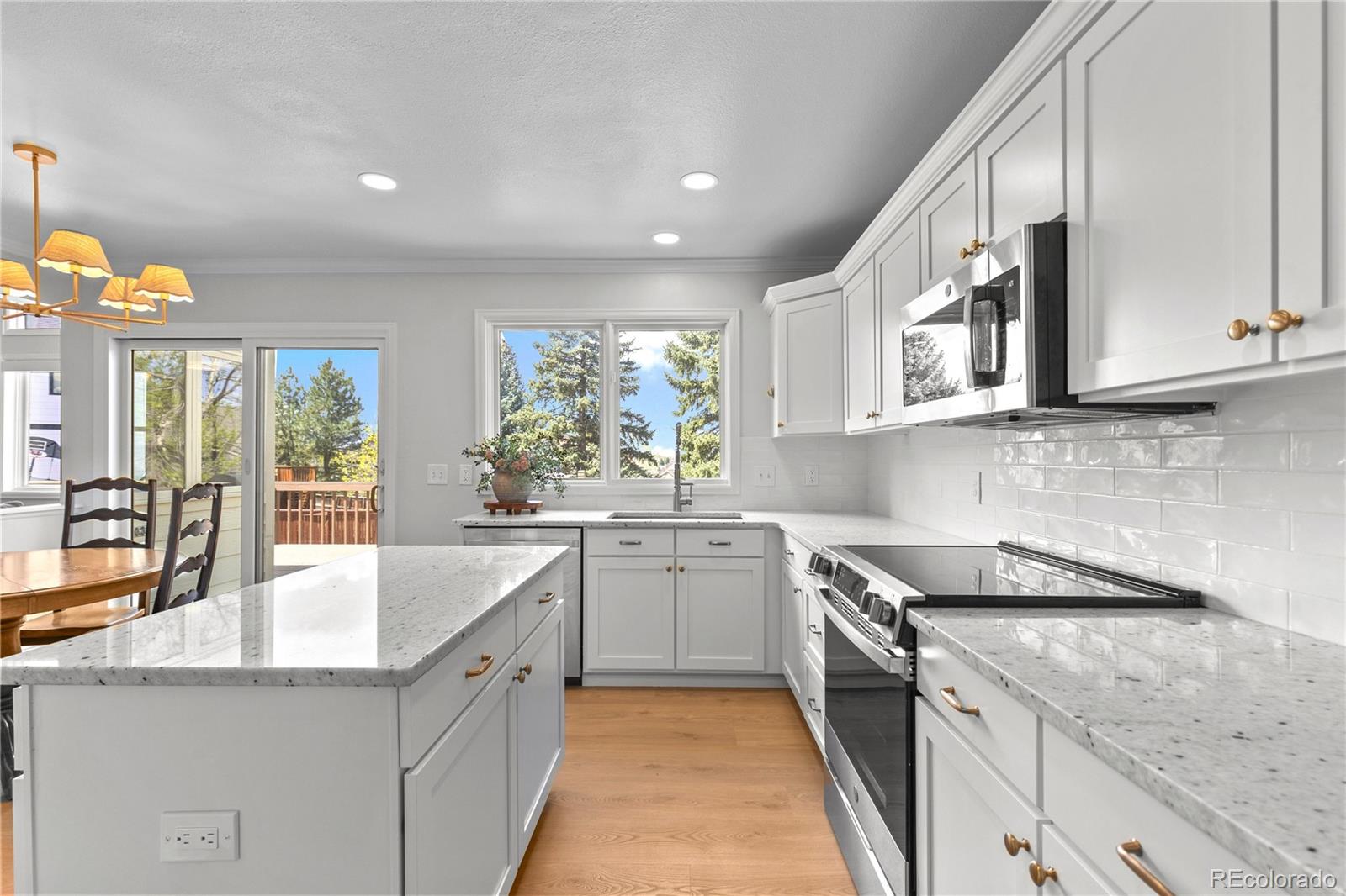 9362 Cornell Circle Highlands Ranch, CO 80130 - Photo 11 of 44 a kitchen with a sink stove and cabinets
