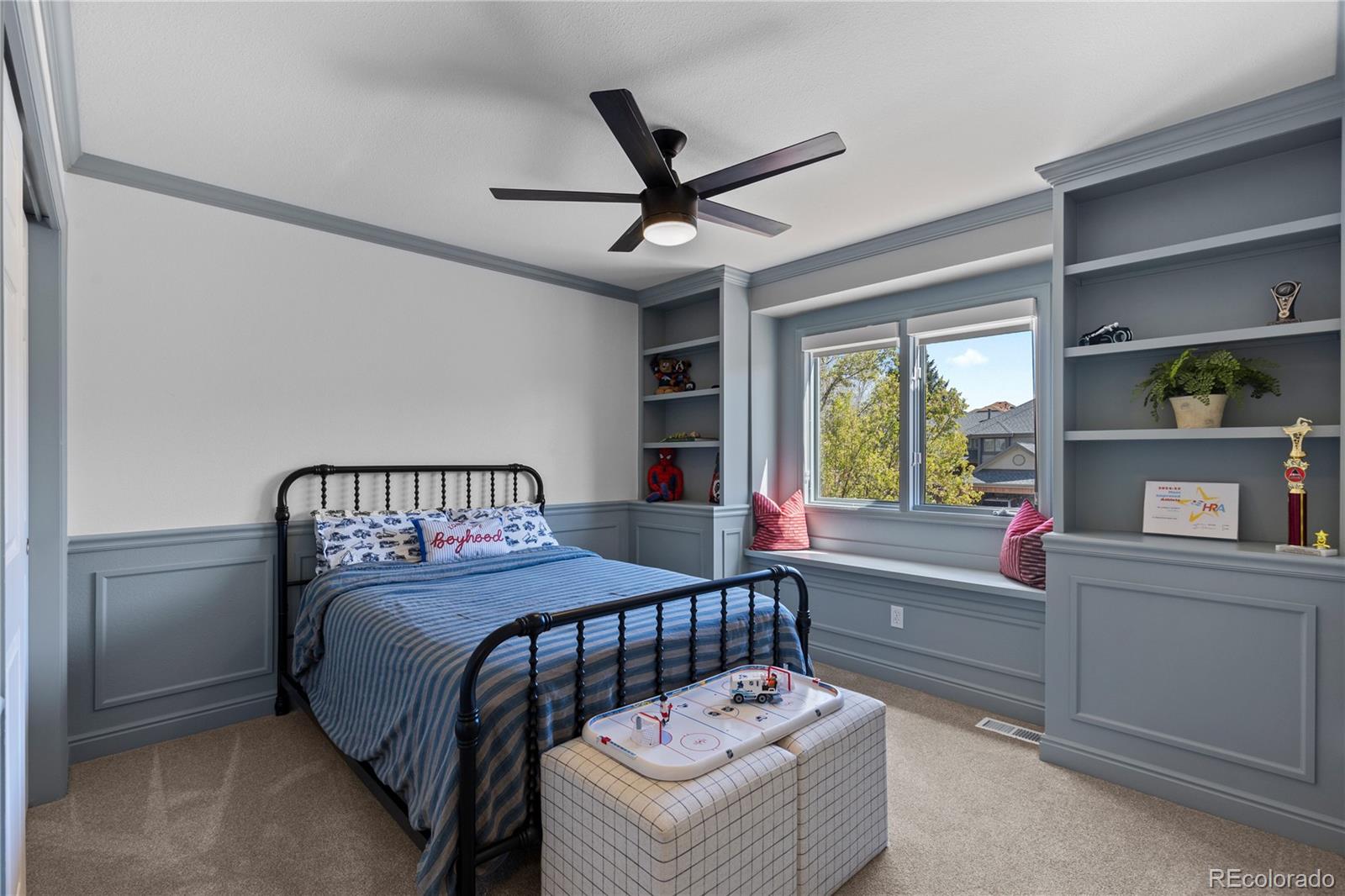 9362 Cornell Circle Highlands Ranch, CO 80130 - Photo 31 of 44 a bedroom with a bed and a chandelier