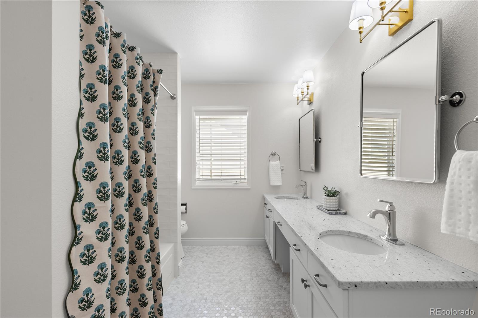 9362 Cornell Circle Highlands Ranch, CO 80130 - Photo 34 of 44 a bathroom with a sink and a mirror