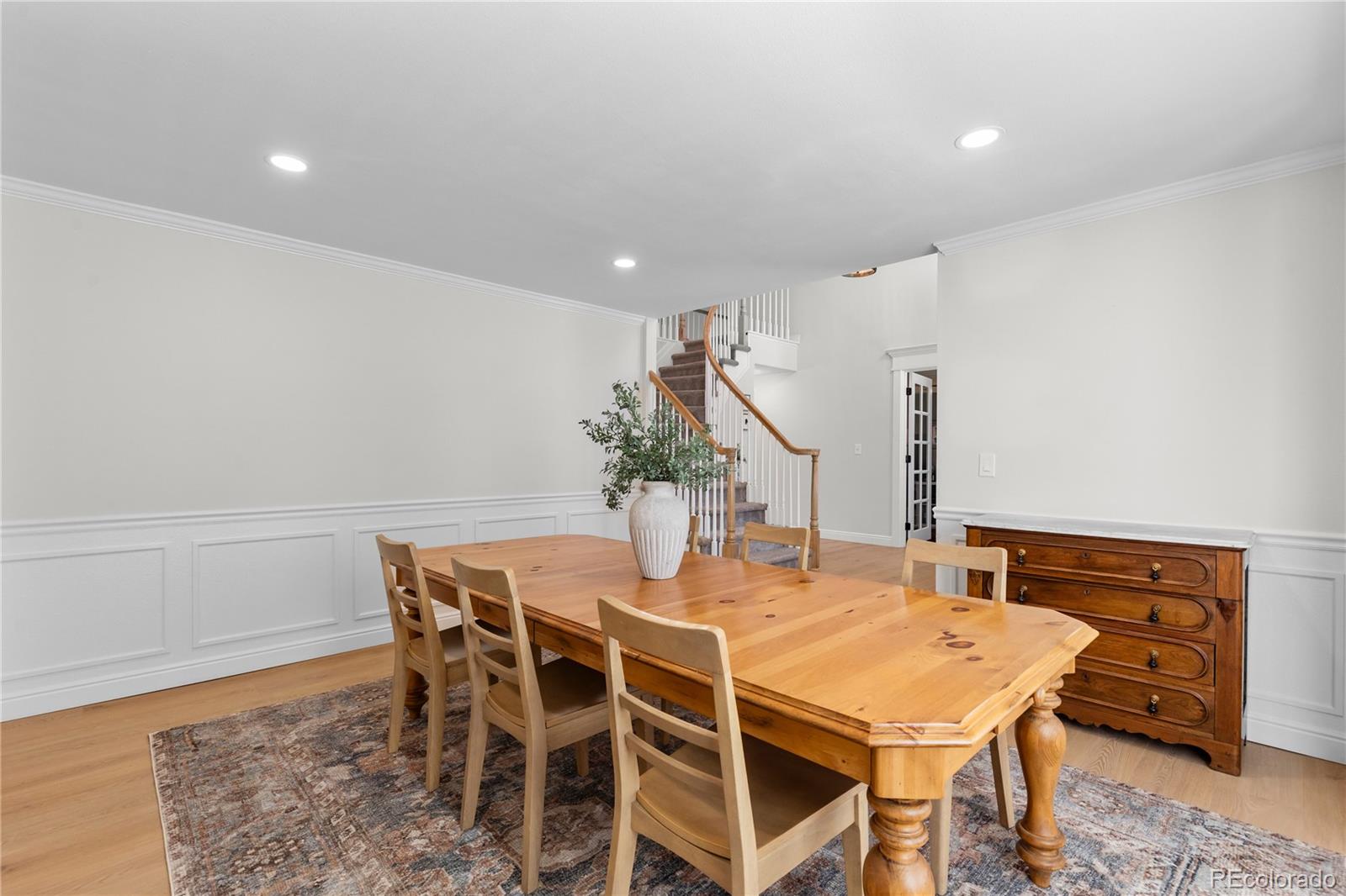 9362 Cornell Circle Highlands Ranch, CO 80130 - Photo 5 of 44 a dining room with furniture and wooden floor
