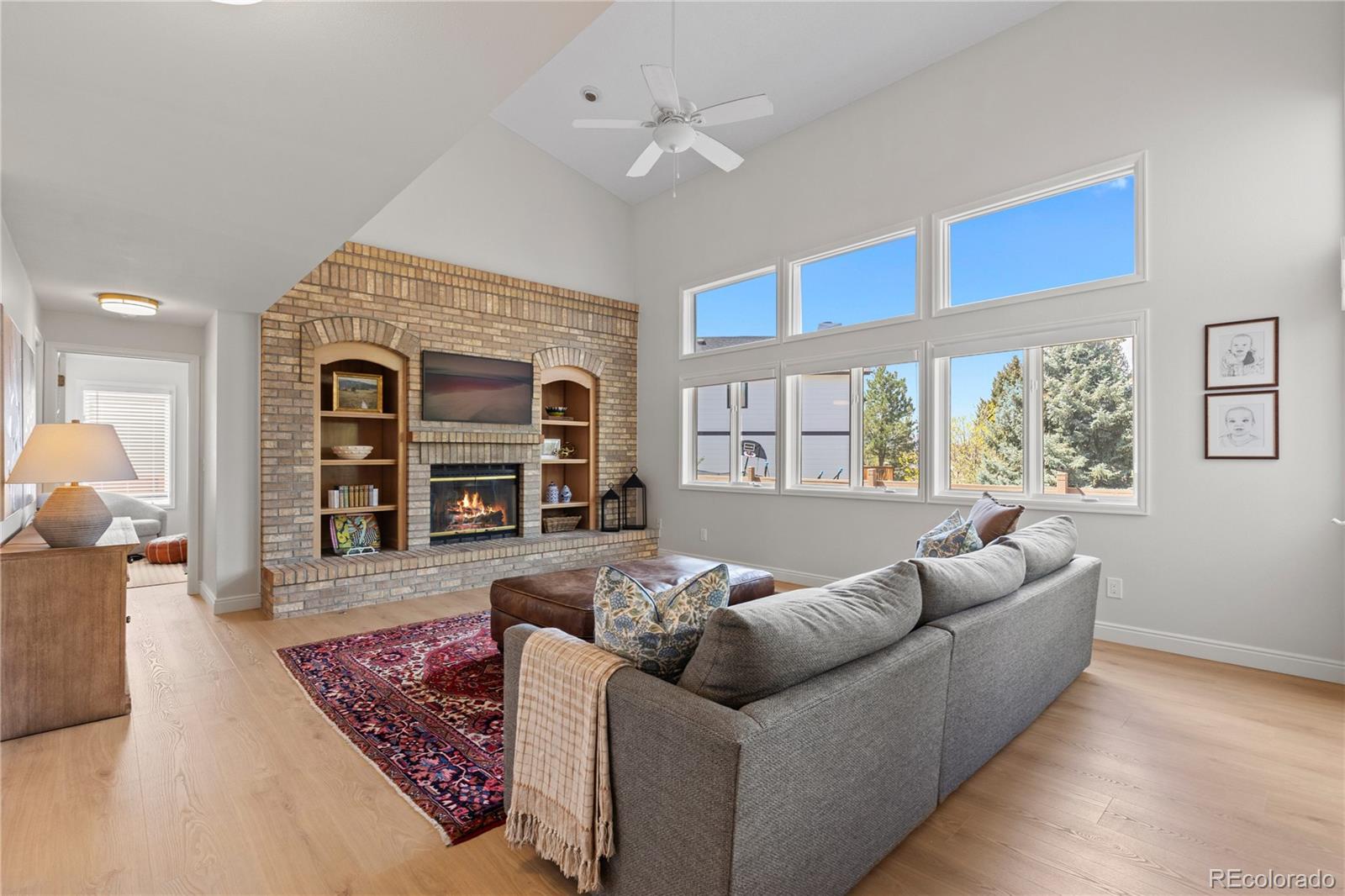 9362 Cornell Circle Highlands Ranch, CO 80130 - Photo 6 of 44 a living room with furniture and a large window