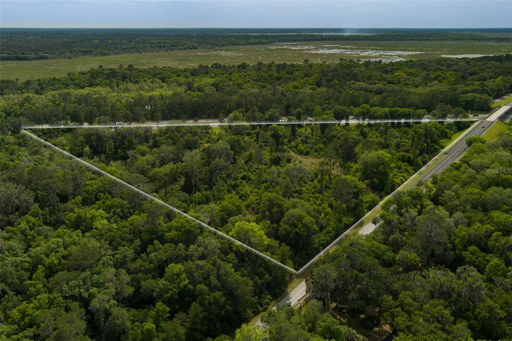 0 Southeast Wacahoota Road Micanopy, FL 32667 - Photo 1 of 1 a view of a city with a lake