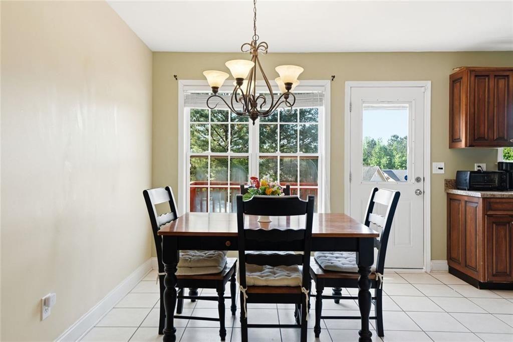 103 Denali Drive Calhoun, GA 30701 - Photo 16 of 39 a view of a dining room with furniture window and outside view