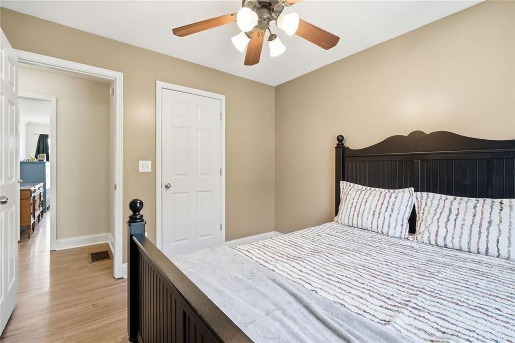 103 Denali Drive Calhoun, GA 30701 - Photo 22 of 39 a bedroom with a bed and a chandelier