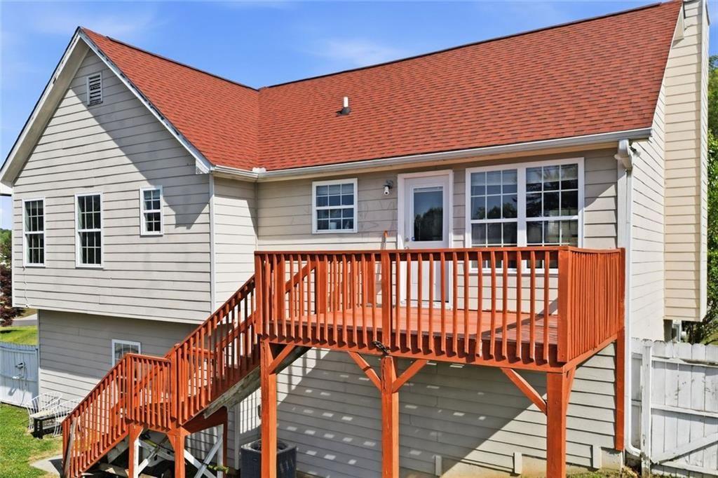 103 Denali Drive Calhoun, GA 30701 - Photo 8 of 39 a view of a house with a wooden deck