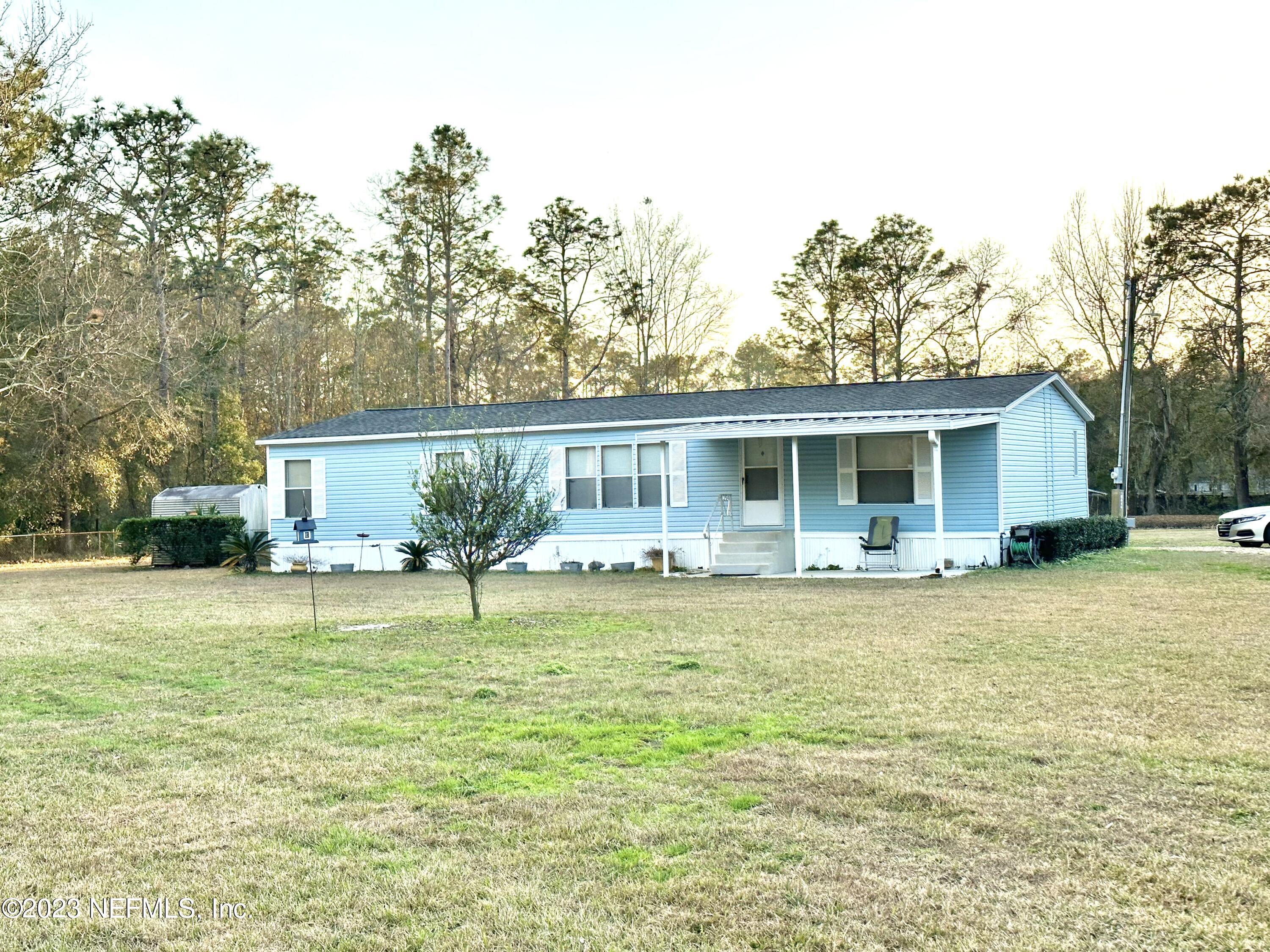 15644 Sears Road Jacksonville, FL 32218 - Photo 1 of 24 a house that has a swimming pool in front of it