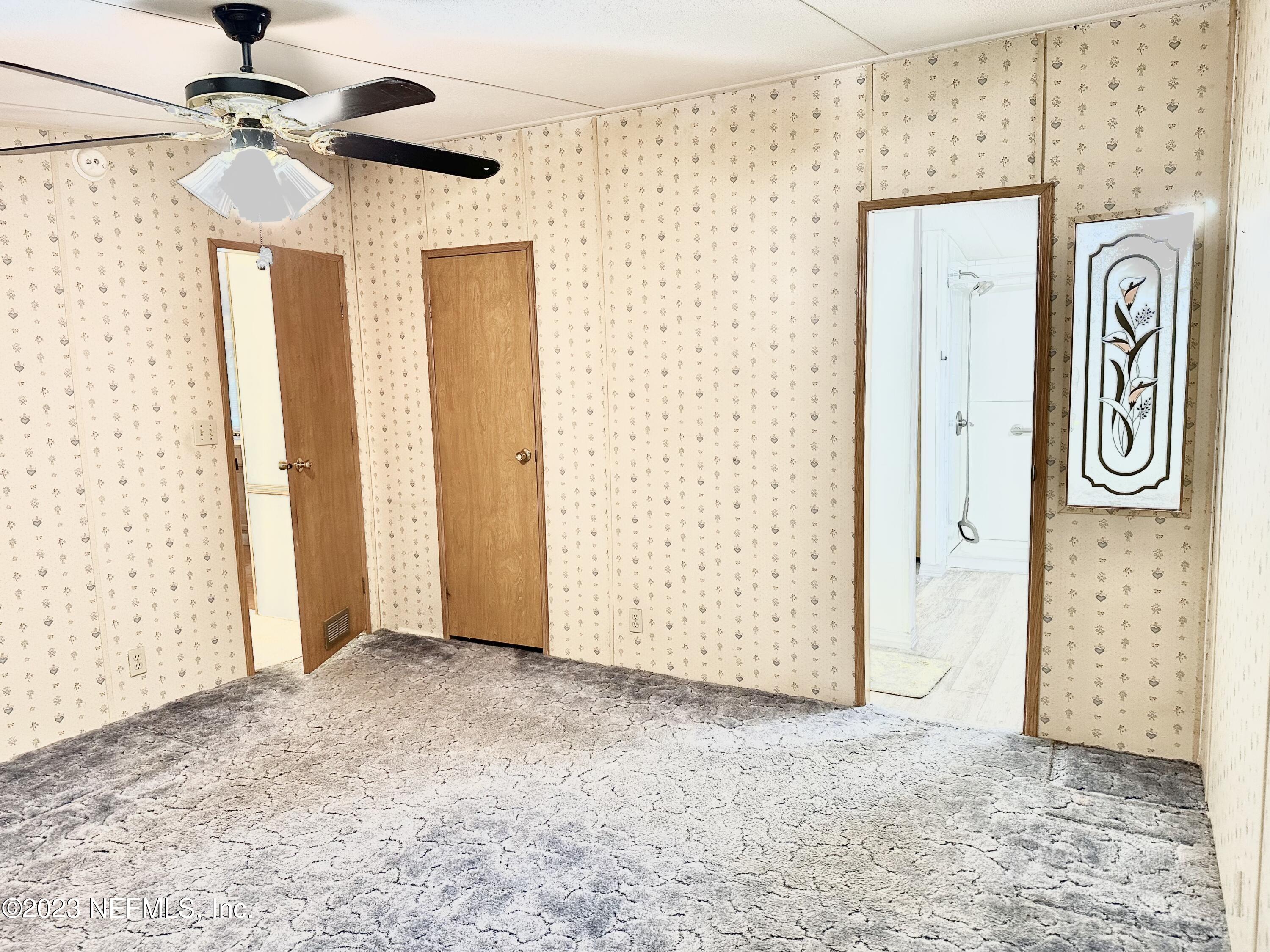 15644 Sears Road Jacksonville, FL 32218 - Photo 24 of 24 a view of a hallway with front door