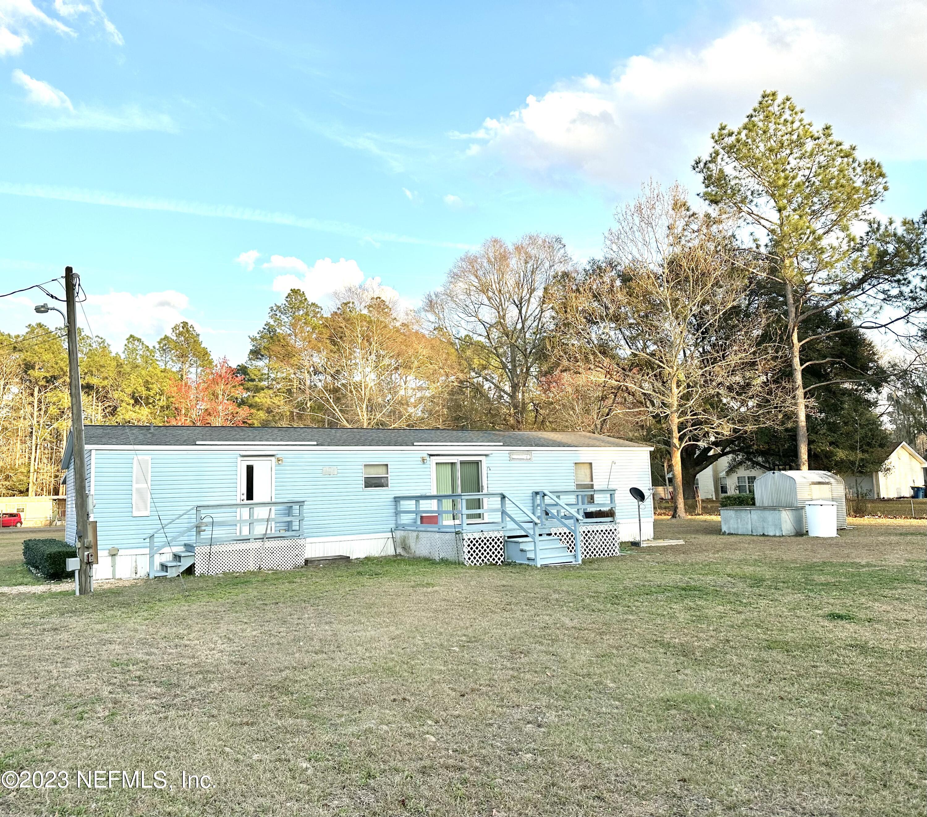 15644 Sears Road Jacksonville, FL 32218 - Photo 5 of 24 a view of house with outdoor space and seating area