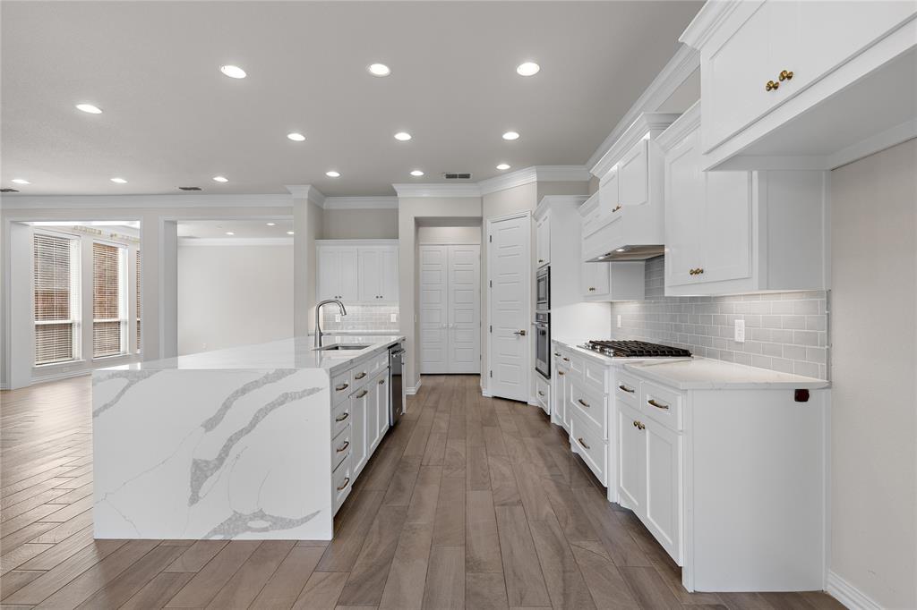 5682 Blackstone Drive Wichita Falls, TX 76310 - Photo 15 of 31 a large kitchen with stainless steel appliances double vanity granite counter tops and a stove