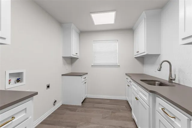 a view of a kitchen with sink and dishwasher