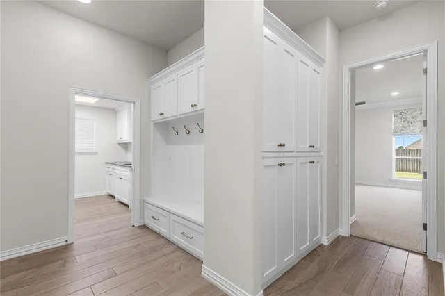 wooden floor with white walls