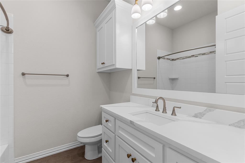 5682 Blackstone Drive Wichita Falls, TX 76310 - Photo 20 of 31 a bathroom with a sink toilet and vanity