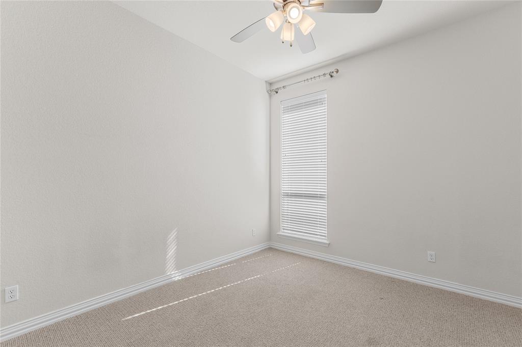 5682 Blackstone Drive Wichita Falls, TX 76310 - Photo 23 of 31 an empty room with a chandelier fan