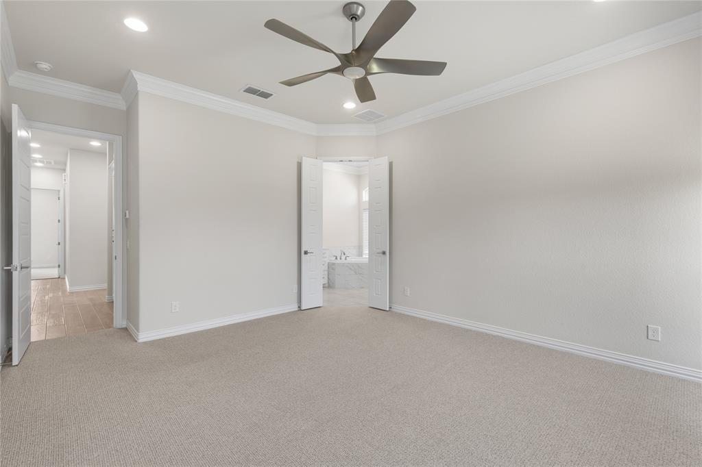 5682 Blackstone Drive Wichita Falls, TX 76310 - Photo 27 of 31 an empty room with closet and a ceiling fan