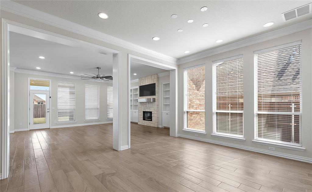 5682 Blackstone Drive Wichita Falls, TX 76310 - Photo 6 of 31 a view of an empty room with wooden floor and a window
