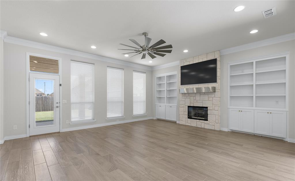 5682 Blackstone Drive Wichita Falls, TX 76310 - Photo 7 of 31 a view of an empty room with a fireplace and a window