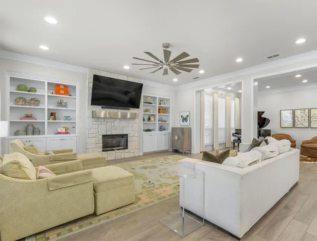 a living room with furniture fireplace and a flat screen tv