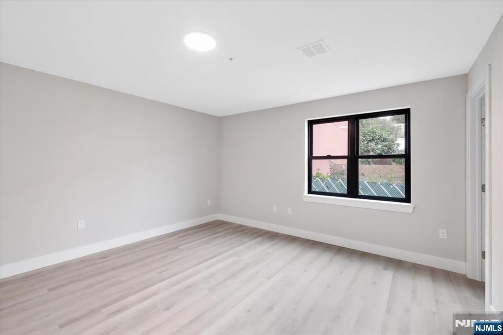 526 64th Street, Unit 3 West New York, NJ 07093 - Photo 12 of 19 an empty room with a window