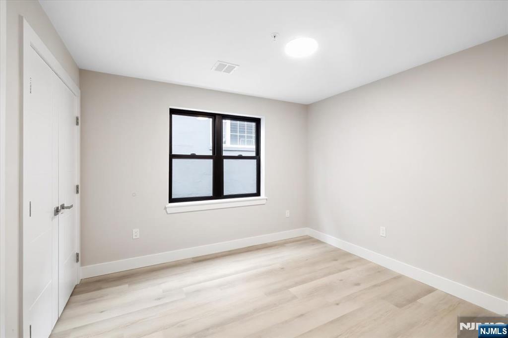 526 64th Street, Unit 3 West New York, NJ 07093 - Photo 8 of 19 an empty room with a window