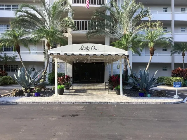 a front view of a house with garage