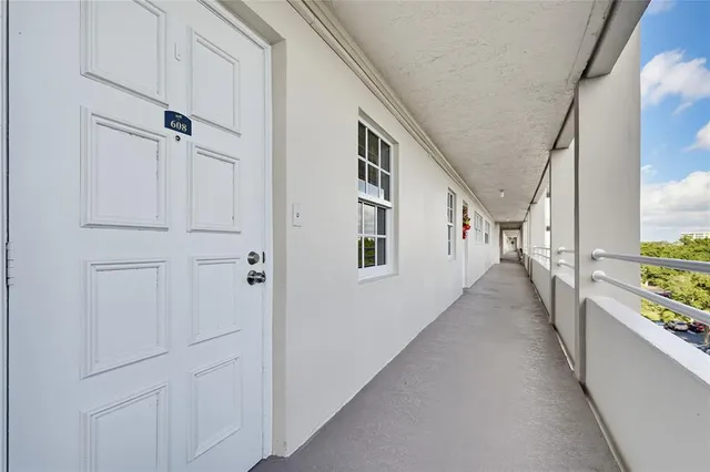a view of a hallway with windows