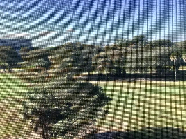 a view of residential houses with outdoor space