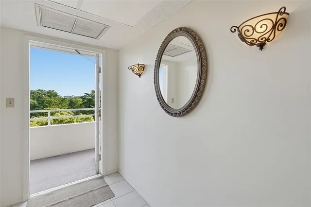 a view of a livingroom with wooden floor and a window