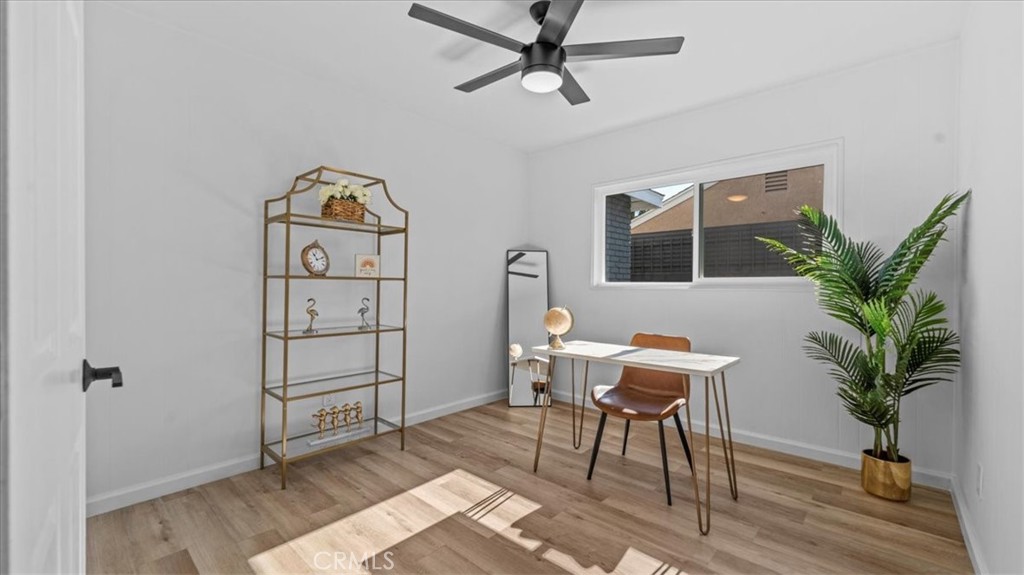 132 South Acacia Avenue Rialto, CA 92376 - Photo 14 of 23 a workspace with furniture window and wooden floor