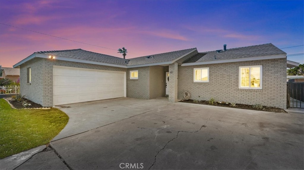 132 South Acacia Avenue Rialto, CA 92376 - Photo 22 of 23 a front view of a house with a yard