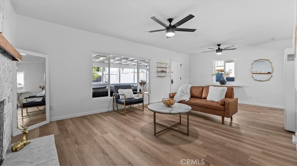 132 South Acacia Avenue Rialto, CA 92376 - Photo 5 of 23 a living room with furniture and a wooden floor