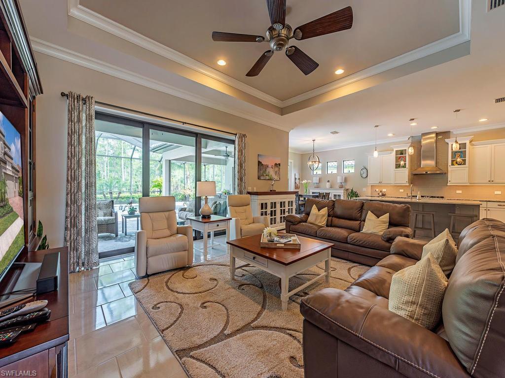 16211 Marsilea Place Naples, FL 34110 - Photo 3 of 17 a living room with furniture and a large window