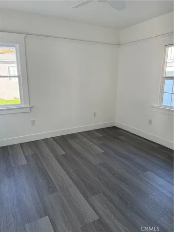 a view of a room that has wooden floor in it