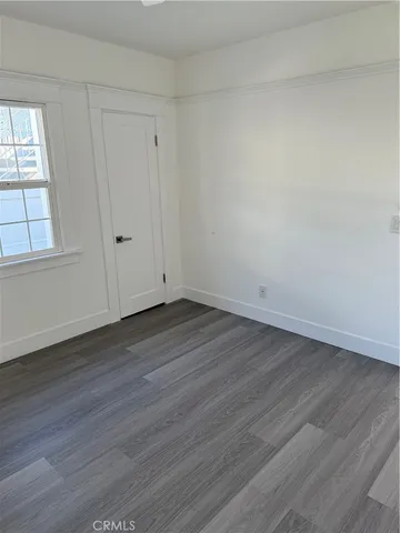 a front view of a house with plants